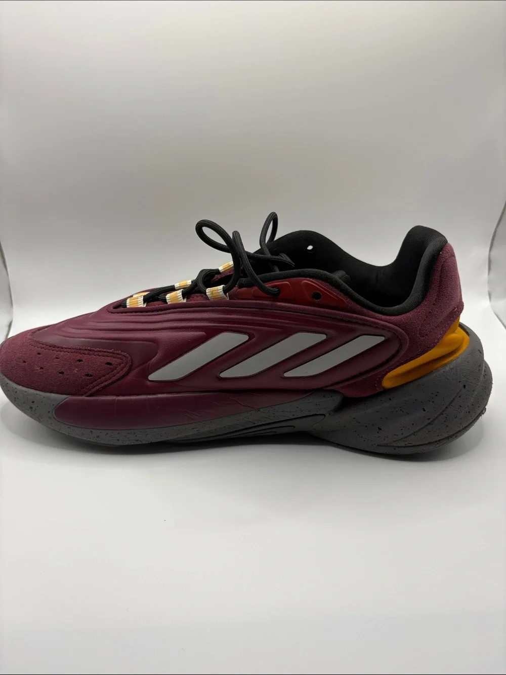 adidas OZELIA Men’s Burgundy and Black Running Sneaker with Yellow Accents